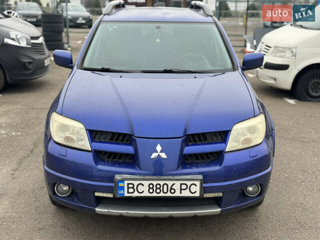 Синий Мицубиси Аутлендер, объемом двигателя 2.4 л и пробегом 245 тыс. км за 4600 $, фото 1 на Automoto.ua