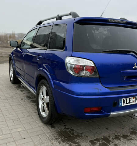 Синий Мицубиси Аутлендер, объемом двигателя 2.4 л и пробегом 243 тыс. км за 5000 $, фото 13 на Automoto.ua