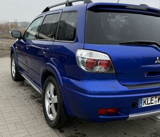 Синий Мицубиси Аутлендер, объемом двигателя 2.4 л и пробегом 243 тыс. км за 5000 $, фото 13 на Automoto.ua