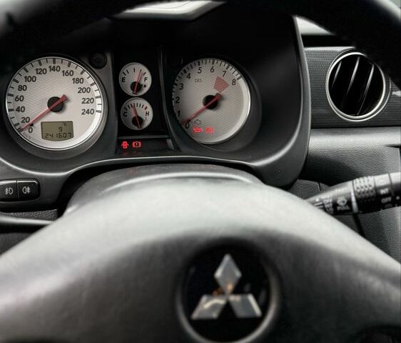 Синий Мицубиси Аутлендер, объемом двигателя 2.4 л и пробегом 243 тыс. км за 5000 $, фото 10 на Automoto.ua