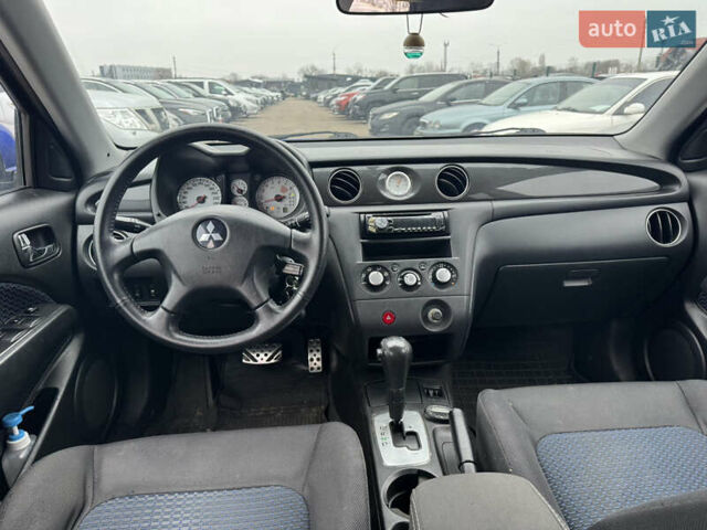 Синий Мицубиси Аутлендер, объемом двигателя 2.4 л и пробегом 245 тыс. км за 4600 $, фото 17 на Automoto.ua