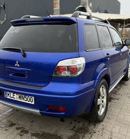 Синий Мицубиси Аутлендер, объемом двигателя 2.4 л и пробегом 243 тыс. км за 5000 $, фото 16 на Automoto.ua