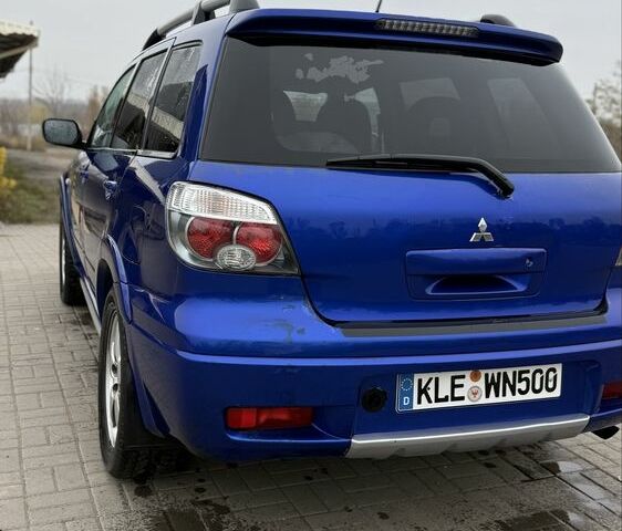 Синий Мицубиси Аутлендер, объемом двигателя 2.4 л и пробегом 243 тыс. км за 5000 $, фото 14 на Automoto.ua