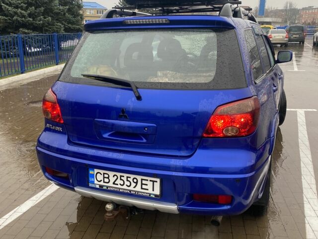 Синий Мицубиси Аутлендер, объемом двигателя 2 л и пробегом 234 тыс. км за 5500 $, фото 3 на Automoto.ua