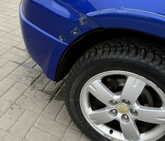 Синий Мицубиси Аутлендер, объемом двигателя 2.4 л и пробегом 243 тыс. км за 5000 $, фото 6 на Automoto.ua