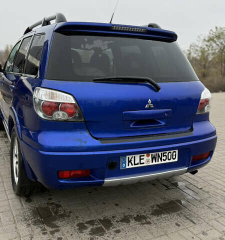 Синий Мицубиси Аутлендер, объемом двигателя 2.4 л и пробегом 243 тыс. км за 5000 $, фото 15 на Automoto.ua