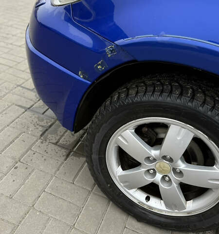 Синий Мицубиси Аутлендер, объемом двигателя 2.4 л и пробегом 243 тыс. км за 5000 $, фото 6 на Automoto.ua