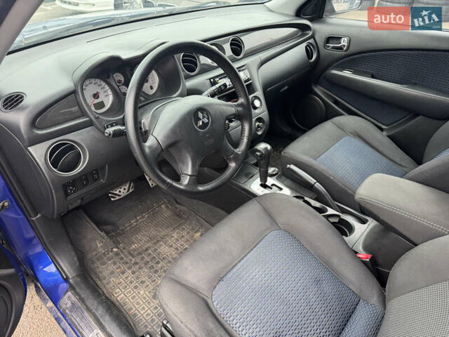 Синий Мицубиси Аутлендер, объемом двигателя 2.4 л и пробегом 245 тыс. км за 4600 $, фото 12 на Automoto.ua