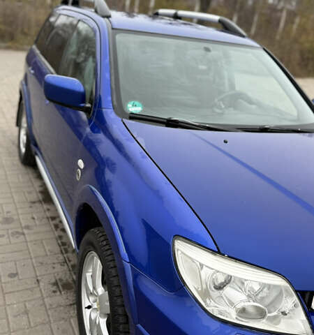 Синий Мицубиси Аутлендер, объемом двигателя 2.4 л и пробегом 243 тыс. км за 5000 $, фото 17 на Automoto.ua