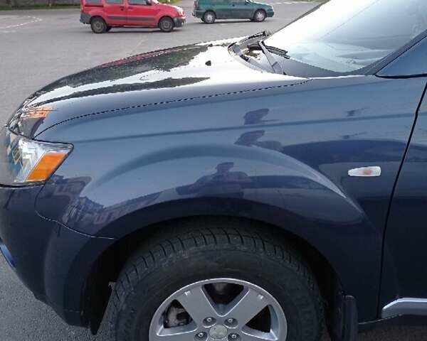 Синий Мицубиси Аутлендер, объемом двигателя 1.97 л и пробегом 196 тыс. км за 8950 $, фото 10 на Automoto.ua