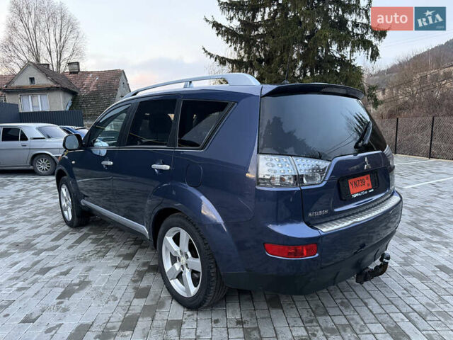Синий Мицубиси Аутлендер, объемом двигателя 2 л и пробегом 228 тыс. км за 8888 $, фото 6 на Automoto.ua