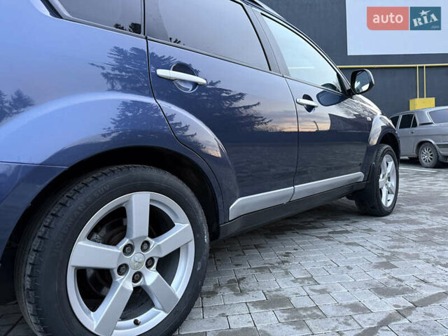 Синий Мицубиси Аутлендер, объемом двигателя 2 л и пробегом 228 тыс. км за 8888 $, фото 16 на Automoto.ua