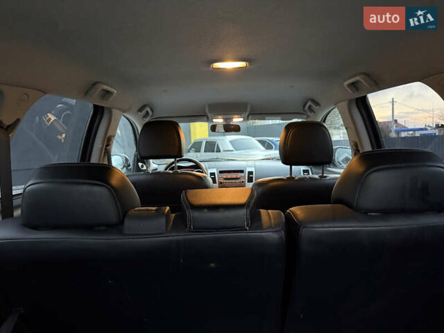 Синий Мицубиси Аутлендер, объемом двигателя 2 л и пробегом 228 тыс. км за 8888 $, фото 47 на Automoto.ua