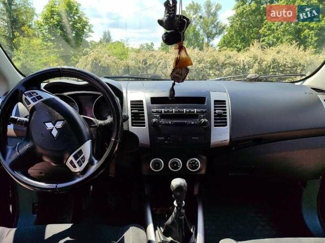 Синий Мицубиси Аутлендер, объемом двигателя 1.97 л и пробегом 196 тыс. км за 8950 $, фото 19 на Automoto.ua
