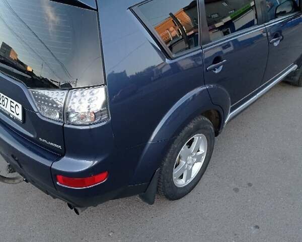 Синий Мицубиси Аутлендер, объемом двигателя 1.97 л и пробегом 196 тыс. км за 8950 $, фото 6 на Automoto.ua