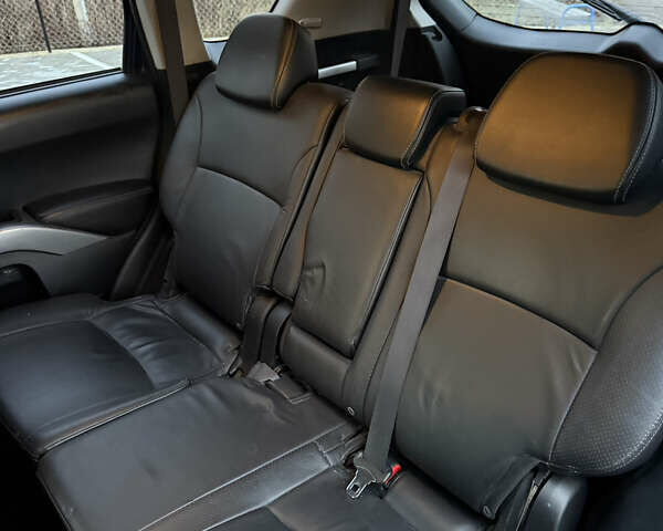 Синий Мицубиси Аутлендер, объемом двигателя 2 л и пробегом 228 тыс. км за 8888 $, фото 31 на Automoto.ua