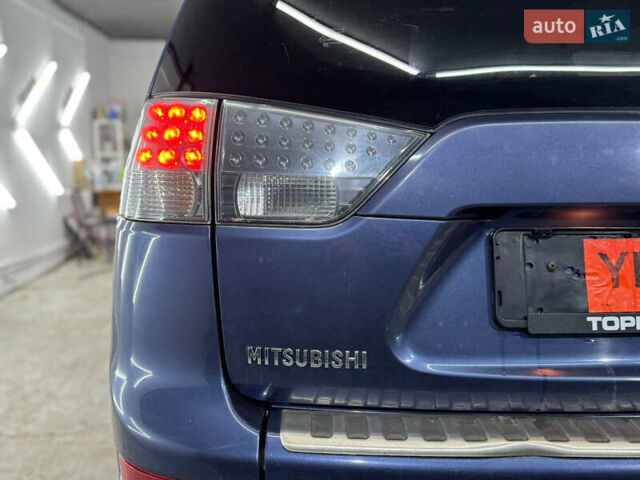 Синий Мицубиси Аутлендер, объемом двигателя 2 л и пробегом 228 тыс. км за 7999 $, фото 12 на Automoto.ua