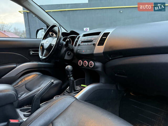 Синий Мицубиси Аутлендер, объемом двигателя 2 л и пробегом 228 тыс. км за 8888 $, фото 41 на Automoto.ua