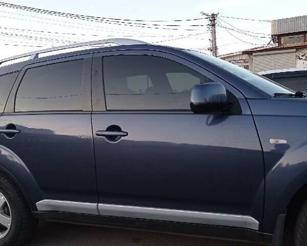 Синий Мицубиси Аутлендер, объемом двигателя 1.97 л и пробегом 196 тыс. км за 8950 $, фото 4 на Automoto.ua
