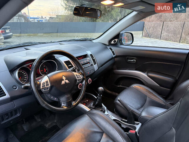 Синий Мицубиси Аутлендер, объемом двигателя 2 л и пробегом 228 тыс. км за 8888 $, фото 23 на Automoto.ua