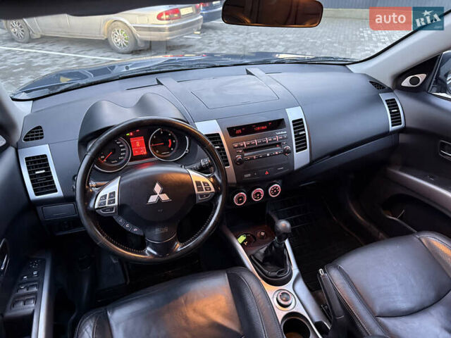 Синий Мицубиси Аутлендер, объемом двигателя 2 л и пробегом 228 тыс. км за 8888 $, фото 28 на Automoto.ua