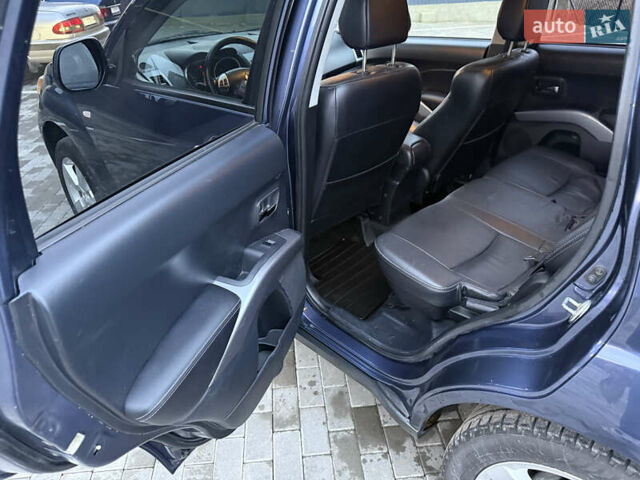 Синий Мицубиси Аутлендер, объемом двигателя 2 л и пробегом 228 тыс. км за 8888 $, фото 29 на Automoto.ua