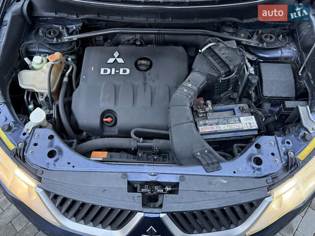 Синий Мицубиси Аутлендер, объемом двигателя 2 л и пробегом 228 тыс. км за 8888 $, фото 51 на Automoto.ua