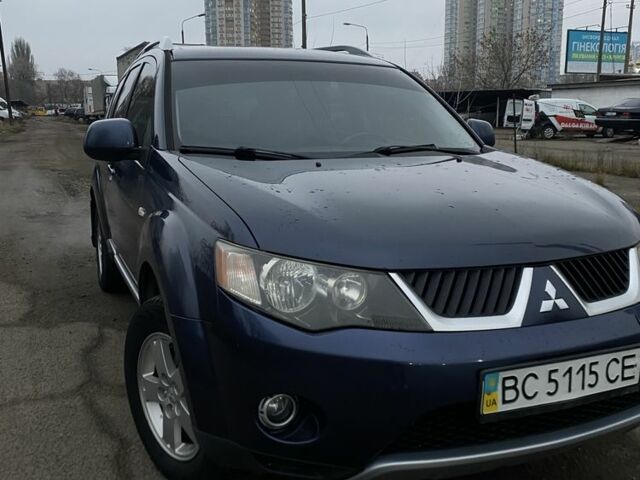 Синий Мицубиси Аутлендер, объемом двигателя 2.4 л и пробегом 250 тыс. км за 6300 $, фото 1 на Automoto.ua