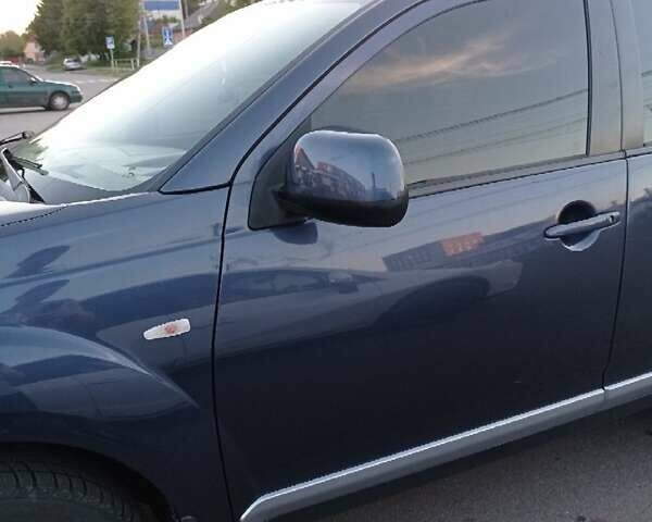 Синий Мицубиси Аутлендер, объемом двигателя 1.97 л и пробегом 196 тыс. км за 8950 $, фото 9 на Automoto.ua