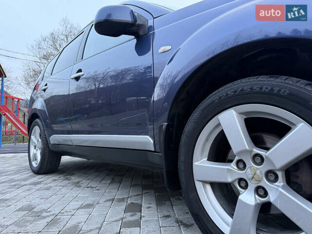 Синий Мицубиси Аутлендер, объемом двигателя 2 л и пробегом 228 тыс. км за 8888 $, фото 17 на Automoto.ua
