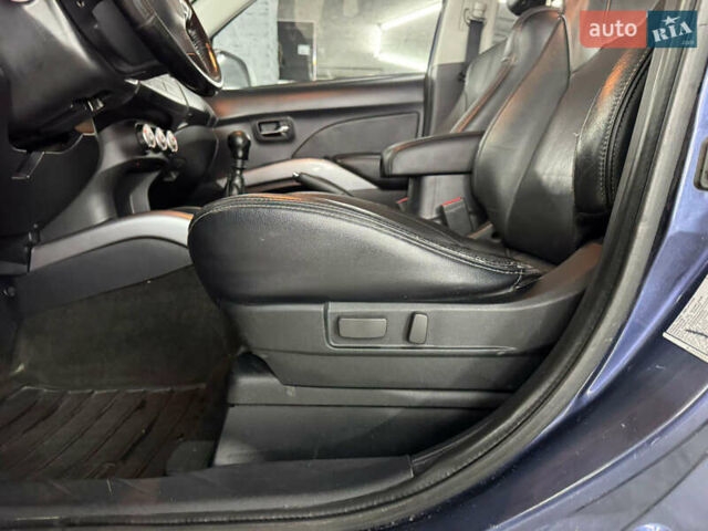 Синий Мицубиси Аутлендер, объемом двигателя 2 л и пробегом 228 тыс. км за 7999 $, фото 21 на Automoto.ua