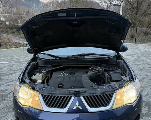 Синий Мицубиси Аутлендер, объемом двигателя 2 л и пробегом 228 тыс. км за 8888 $, фото 49 на Automoto.ua