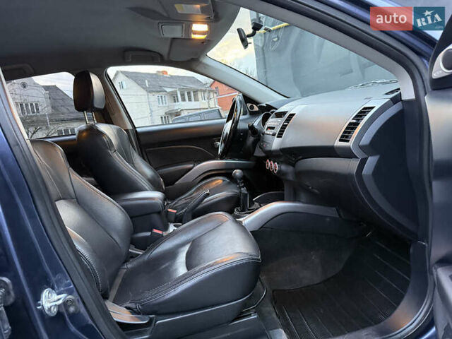 Синий Мицубиси Аутлендер, объемом двигателя 2 л и пробегом 228 тыс. км за 8888 $, фото 39 на Automoto.ua