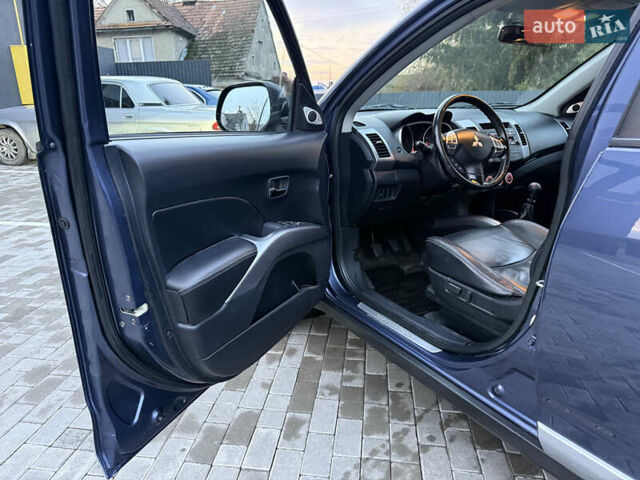 Синий Мицубиси Аутлендер, объемом двигателя 2 л и пробегом 228 тыс. км за 8888 $, фото 20 на Automoto.ua