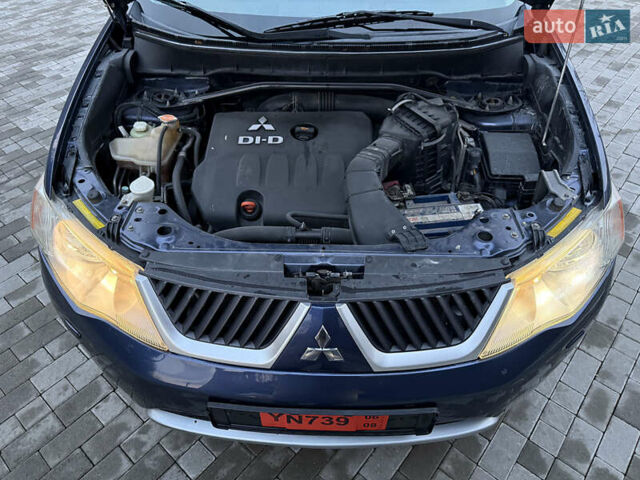 Синий Мицубиси Аутлендер, объемом двигателя 2 л и пробегом 228 тыс. км за 8888 $, фото 50 на Automoto.ua