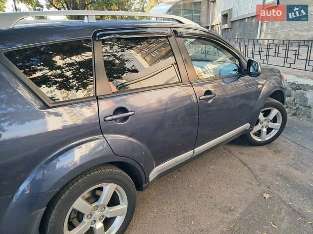 Синий Мицубиси Аутлендер, объемом двигателя 2.4 л и пробегом 160 тыс. км за 8800 $, фото 4 на Automoto.ua