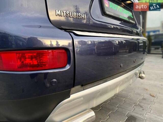 Синій Міцубісі Аутлендер, об'ємом двигуна 2.36 л та пробігом 282 тис. км за 9490 $, фото 10 на Automoto.ua