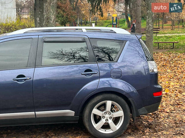 Синій Міцубісі Аутлендер, об'ємом двигуна 2.4 л та пробігом 211 тис. км за 8390 $, фото 6 на Automoto.ua
