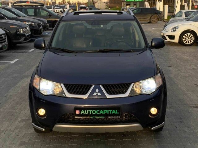 Синий Мицубиси Аутлендер, объемом двигателя 2.4 л и пробегом 282 тыс. км за 9490 $, фото 1 на Automoto.ua