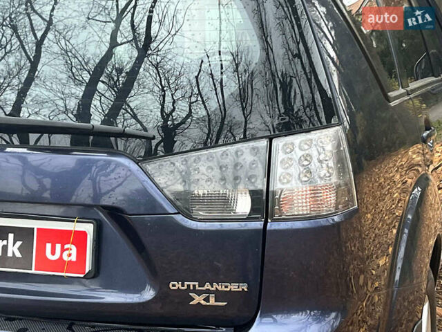 Синій Міцубісі Аутлендер, об'ємом двигуна 2.4 л та пробігом 211 тис. км за 8390 $, фото 10 на Automoto.ua