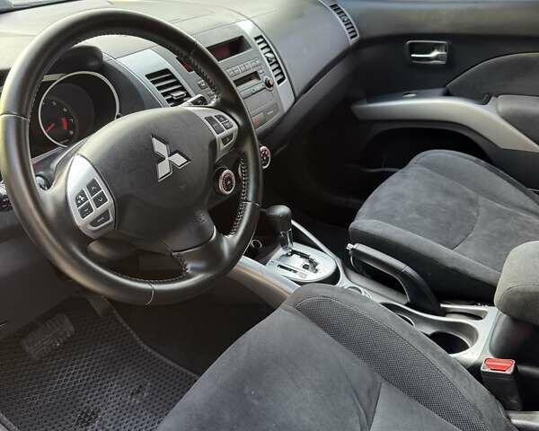 Синий Мицубиси Аутлендер, объемом двигателя 2.36 л и пробегом 223 тыс. км за 8650 $, фото 8 на Automoto.ua