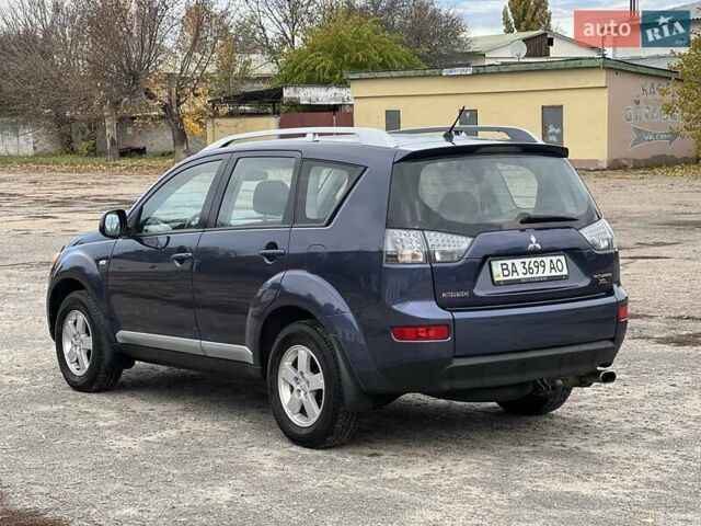 Синий Мицубиси Аутлендер, объемом двигателя 2.4 л и пробегом 94 тыс. км за 8800 $, фото 1 на Automoto.ua