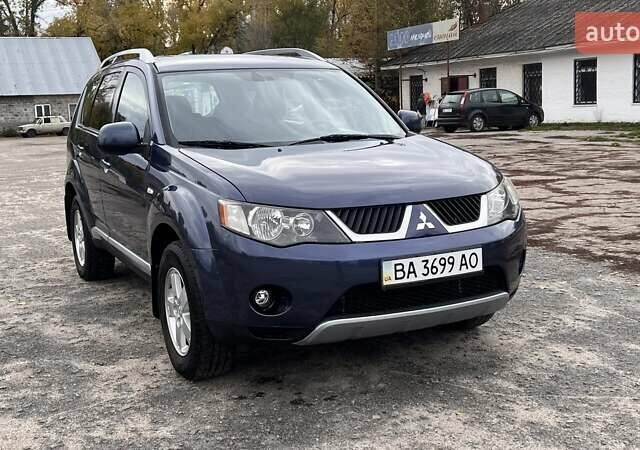 Синий Мицубиси Аутлендер, объемом двигателя 2.4 л и пробегом 94 тыс. км за 8800 $, фото 3 на Automoto.ua