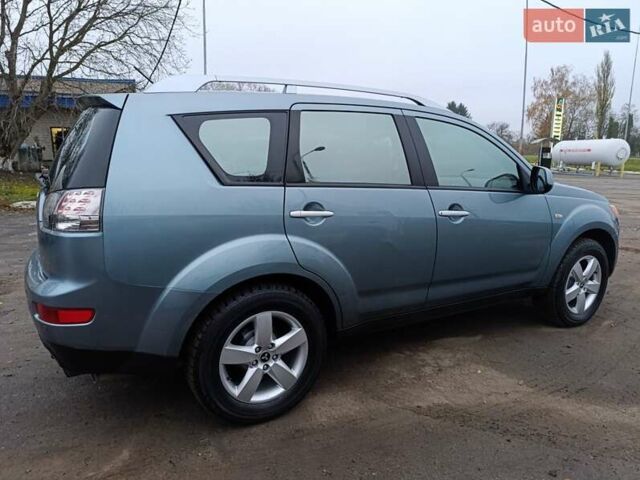 Синий Мицубиси Аутлендер, объемом двигателя 2.4 л и пробегом 264 тыс. км за 7555 $, фото 9 на Automoto.ua