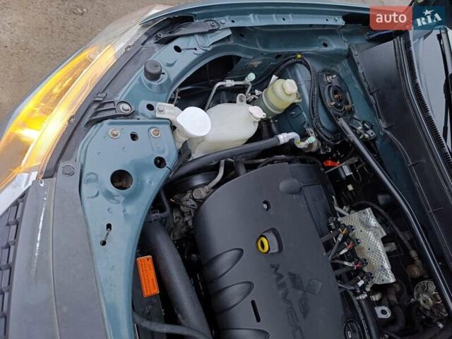 Синий Мицубиси Аутлендер, объемом двигателя 2.4 л и пробегом 264 тыс. км за 7555 $, фото 40 на Automoto.ua