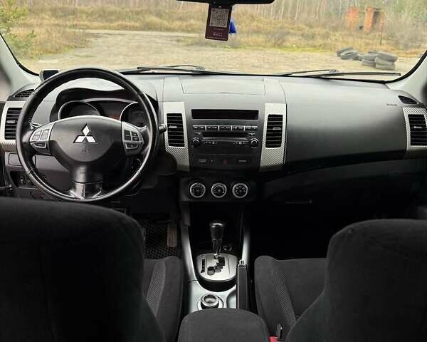 Синий Мицубиси Аутлендер, объемом двигателя 2.4 л и пробегом 211 тыс. км за 7800 $, фото 10 на Automoto.ua