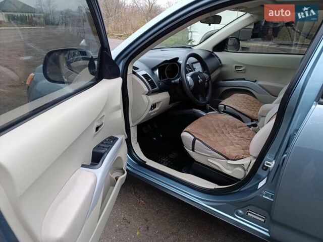 Синий Мицубиси Аутлендер, объемом двигателя 2.4 л и пробегом 264 тыс. км за 7555 $, фото 18 на Automoto.ua