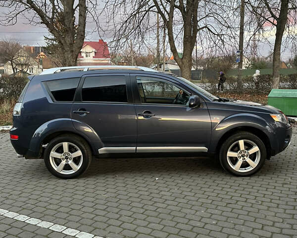 Синий Мицубиси Аутлендер, объемом двигателя 2 л и пробегом 263 тыс. км за 8900 $, фото 4 на Automoto.ua