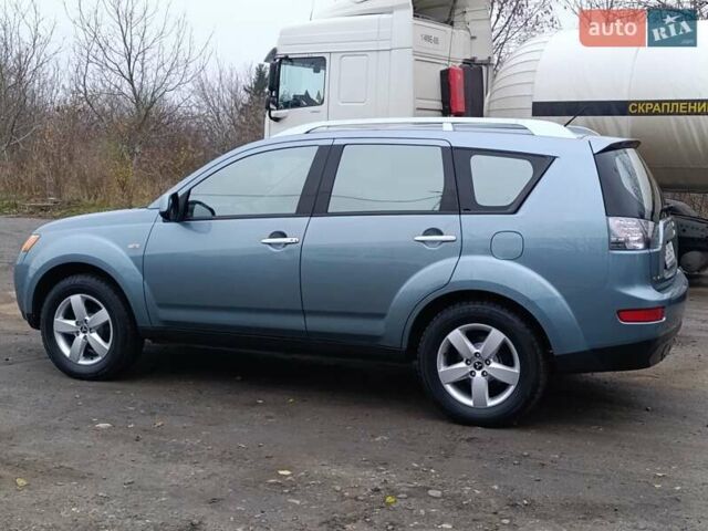 Синий Мицубиси Аутлендер, объемом двигателя 2.4 л и пробегом 264 тыс. км за 7555 $, фото 5 на Automoto.ua