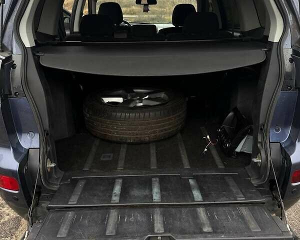 Синий Мицубиси Аутлендер, объемом двигателя 2.4 л и пробегом 211 тыс. км за 7800 $, фото 8 на Automoto.ua